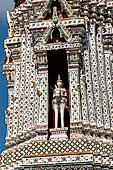 Bangkok Wat Arun - Detail of the niches of each minor prang with statues of Nayu, the god of wind, on horseback. 